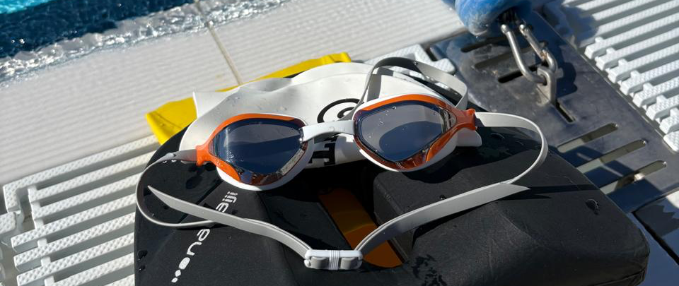 Effortless Swimming Viper goggles on the edge of the pool